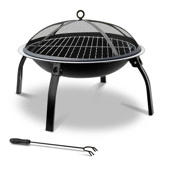 A portable black fire pit with a foldable design, featuring a mesh dome lid and a poker tool next to it, set on a white background.