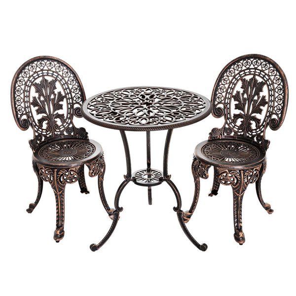 A bronze Gardeon 3-piece patio furniture set including a round table and two chairs with intricate cut-out patterns, designed for outdoor bistro use.