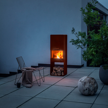 Load image into Gallery viewer, Firebox Garden Wood Burner Fire Pit burning a fire on a patio area