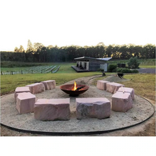 Load image into Gallery viewer, The Cauldron Fire Pit 1500mm in rural setting with large stone seats around it