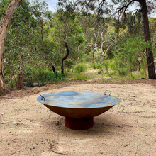 Load image into Gallery viewer, Cauldron 80cm Cast Iron Fire Pit in an outdoor area with steel lid