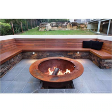Load image into Gallery viewer, Burning a fire in the cast iron Teppanyaki Fire Pit 