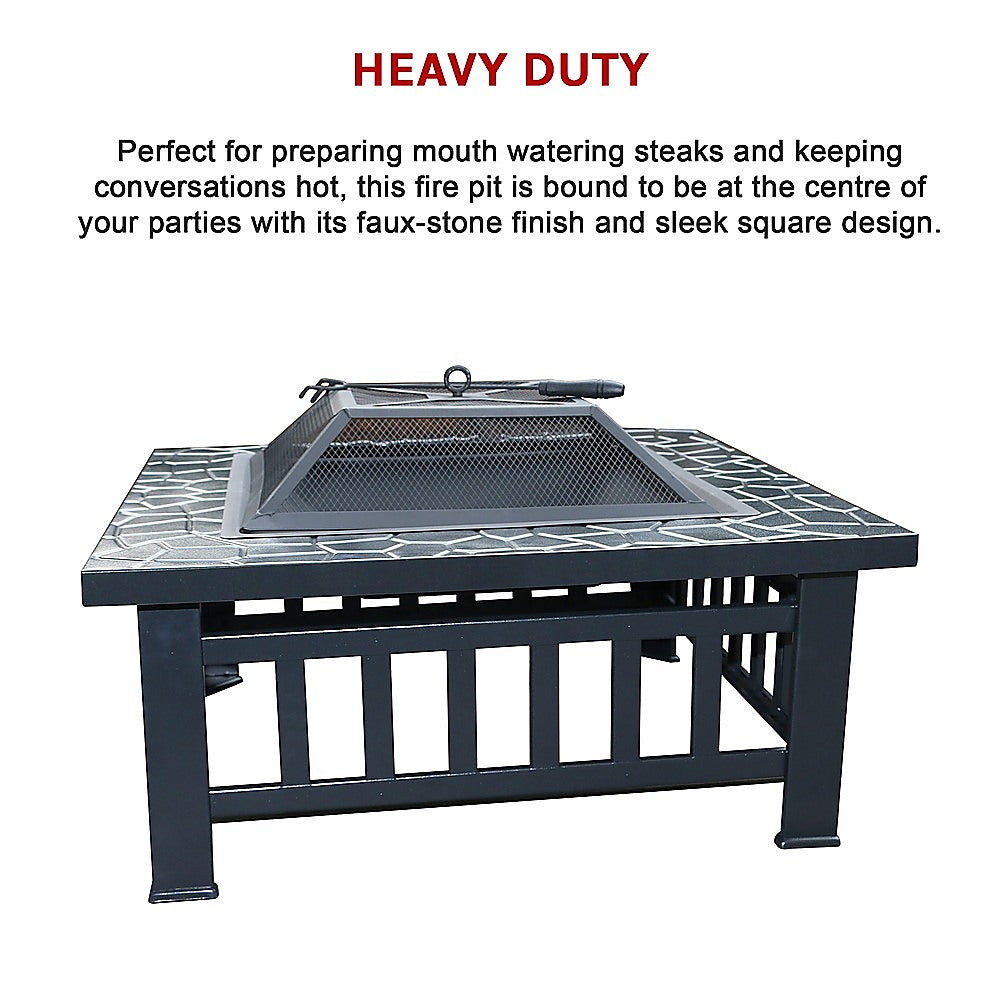Square Metal Fire Pit Outdoor Heater set in a table with a mesh screen top with a faux-stone finish and set on a white background.