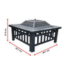 Square Metal Fire Pit Outdoor Heater set in a table with a mesh screen top with a faux-stone finish, shoing its dimensions and set on a white background.