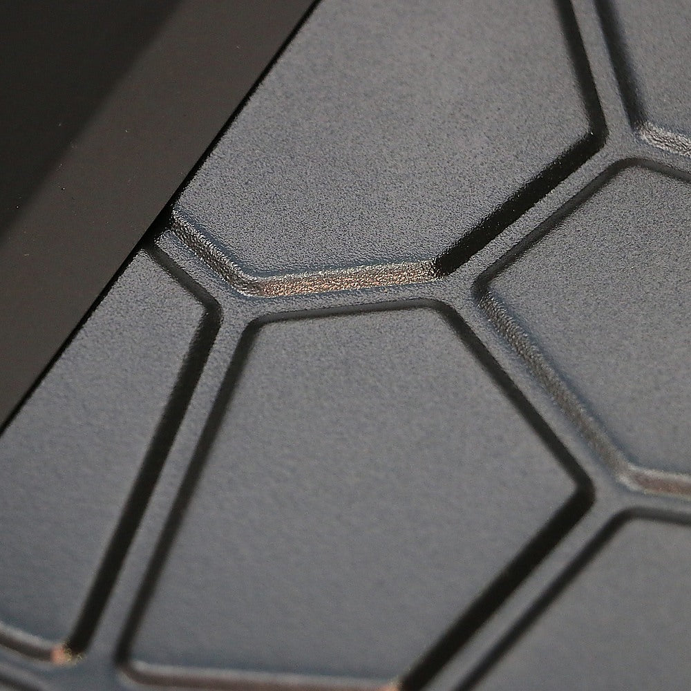 Close-up image of the metal on a metal fire pit.