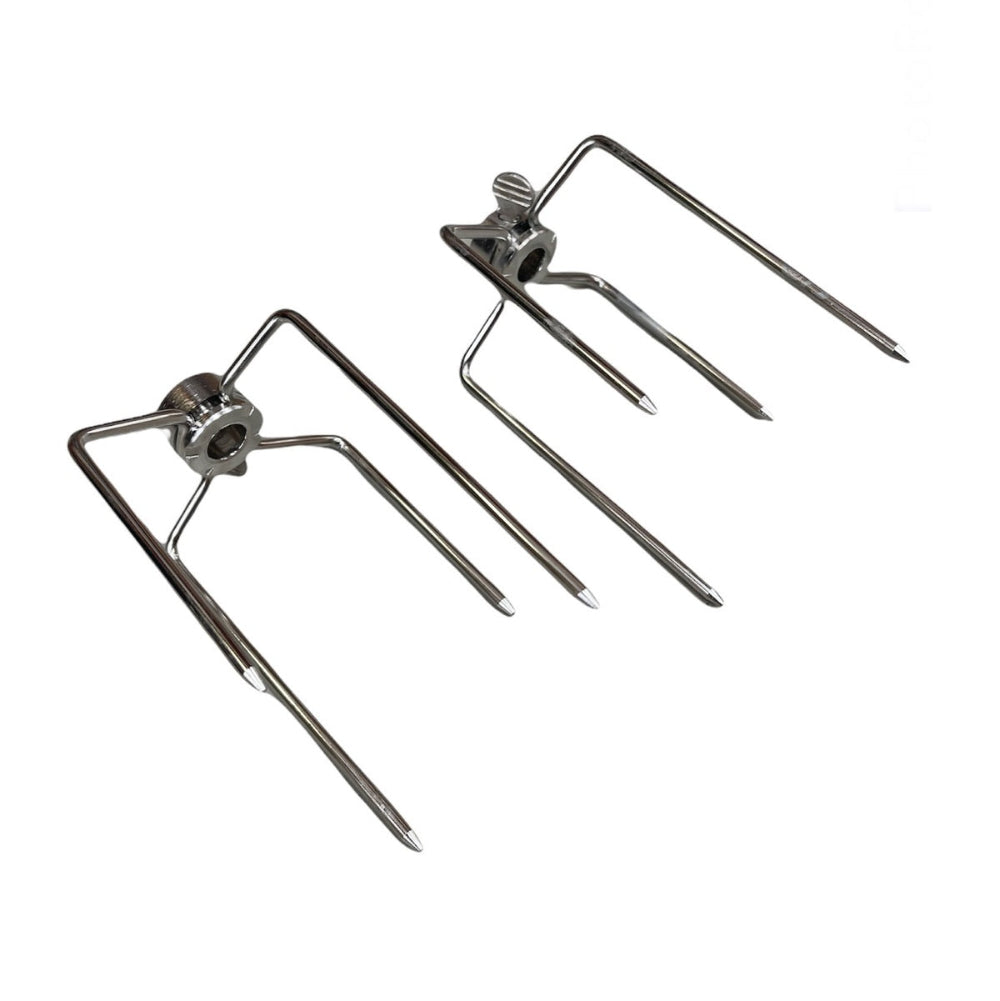 Two metal rotisserie spit forks on a white background