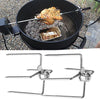 Portable grill with chicken on a skewer over hot coals, showing a close-up of the grill's metal structure.