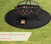 Fire pit with a fire on a fire pit black mat on grass, featuring text about fireproof properties.
