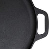 Close-up of a black cast iron skillet with a handle on a white background