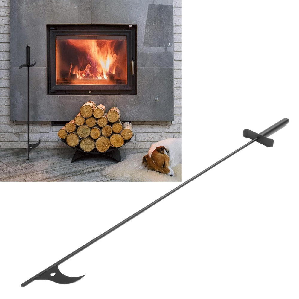 A long black metal fireplace tool with a curved hook at one end and a T-shaped handle at the other is shown prominently on a white background, with a smaller inset photo of a fireplace scene featuring a log rack and dog.