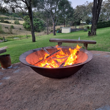 Load image into Gallery viewer, The Crucible Fire Pit with a fire burning in a country backyard - Hot Fire Pits Australia