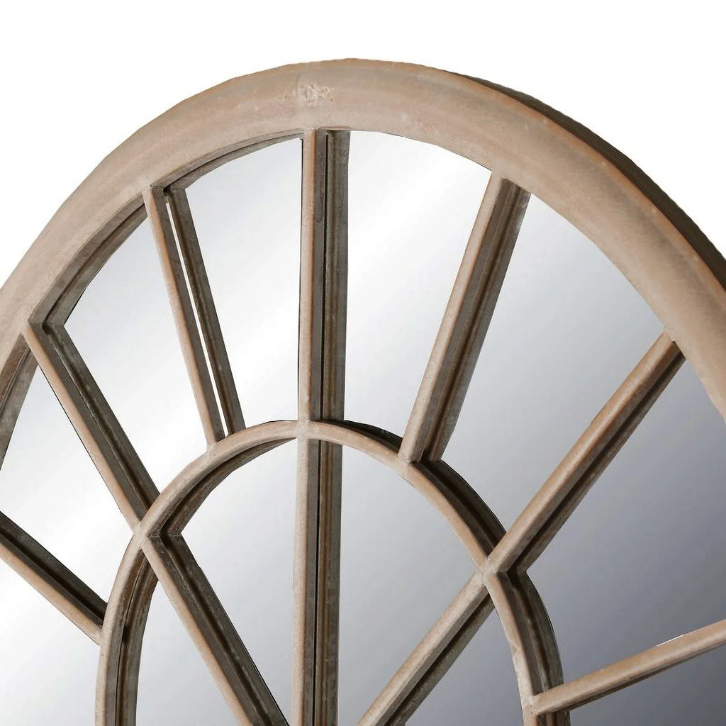 Close up view of the arch design on the top of the Emily sand coloured Metal Frame Garden Mirror on a white background.