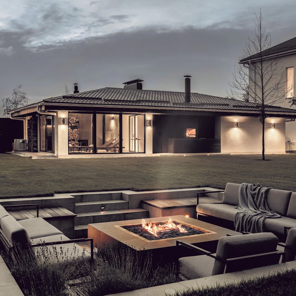 Galio Gas Fire Pit H Insert in an outdoor garden setting with a tiled tabletop - Hot Fire Pits Australia