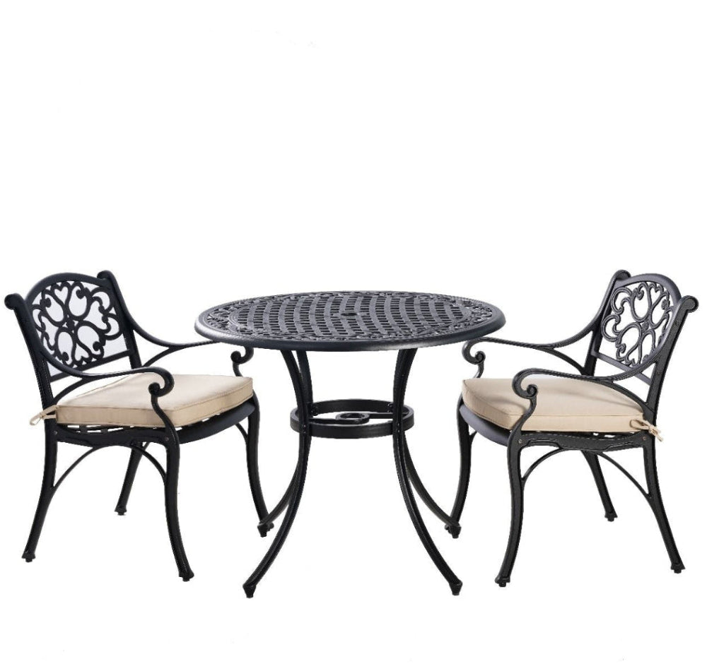 Outdoor furniture set with a round table and two chairs on a white background