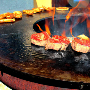 Cooking potato and steaks on a Teppanyaki style Ringgrill BBQ Grill