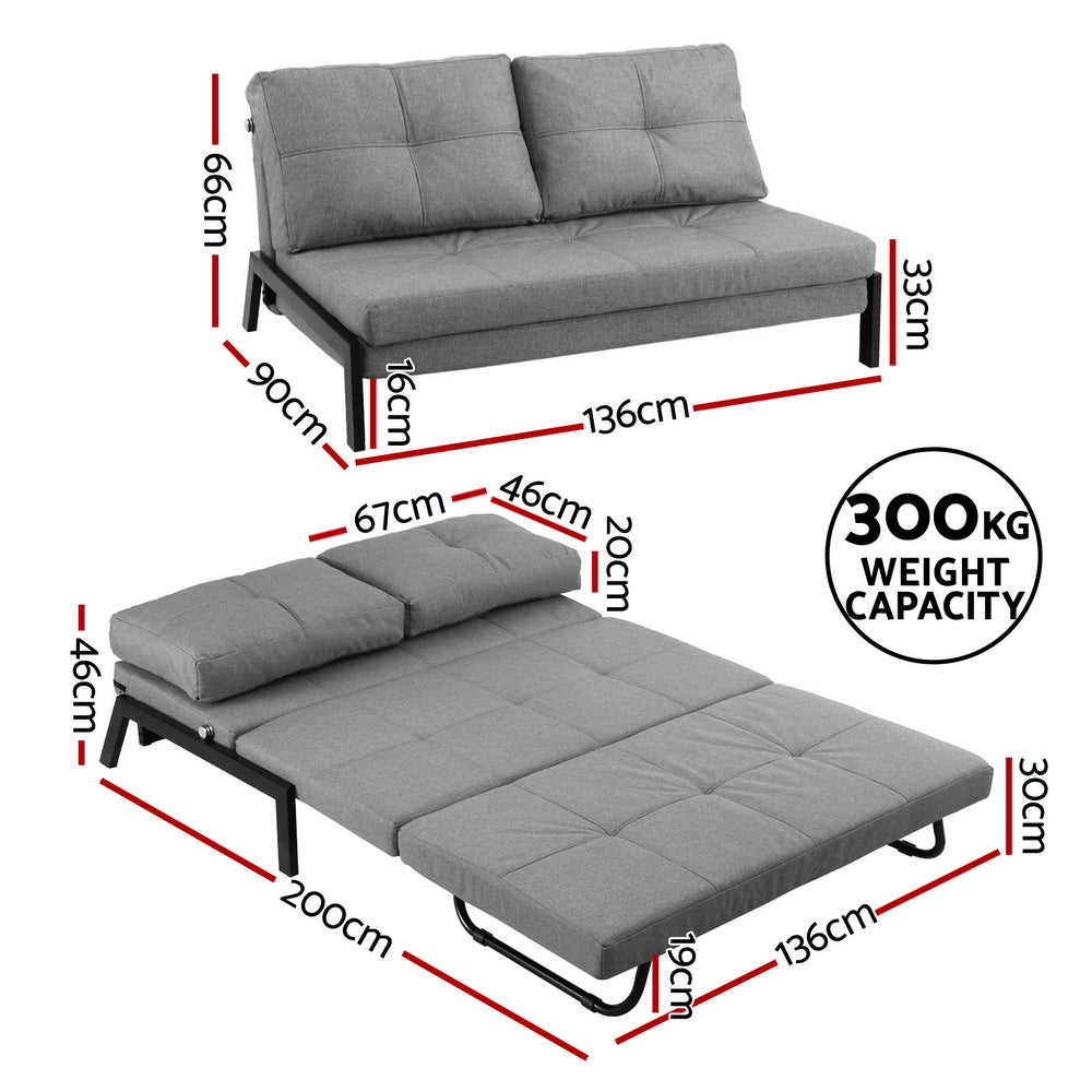 Gray sofa bed with dimensions and weight capacity label on a white background