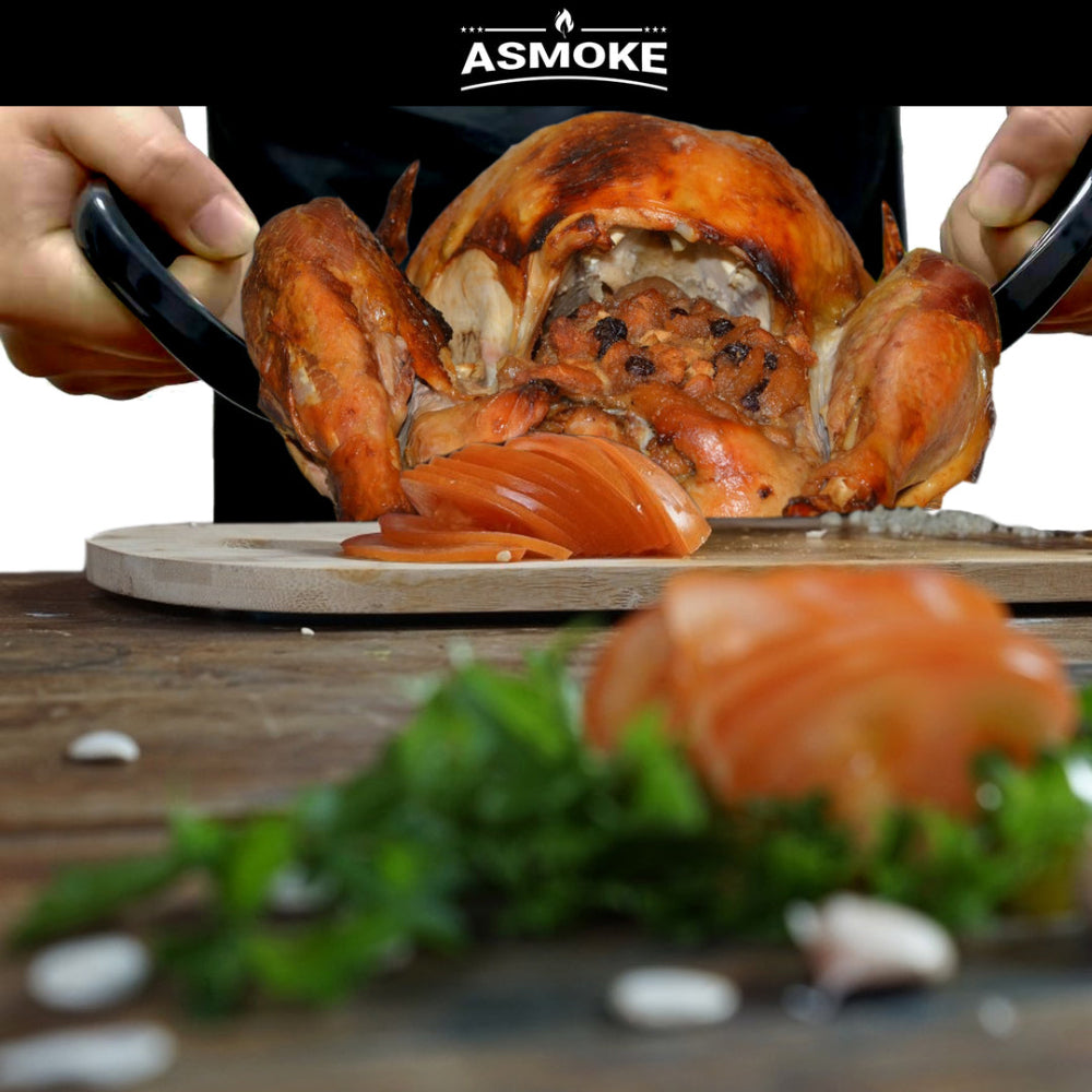 Person slicing a roasted chicken on a wooden cutting board with 'ASMOKE' branding.