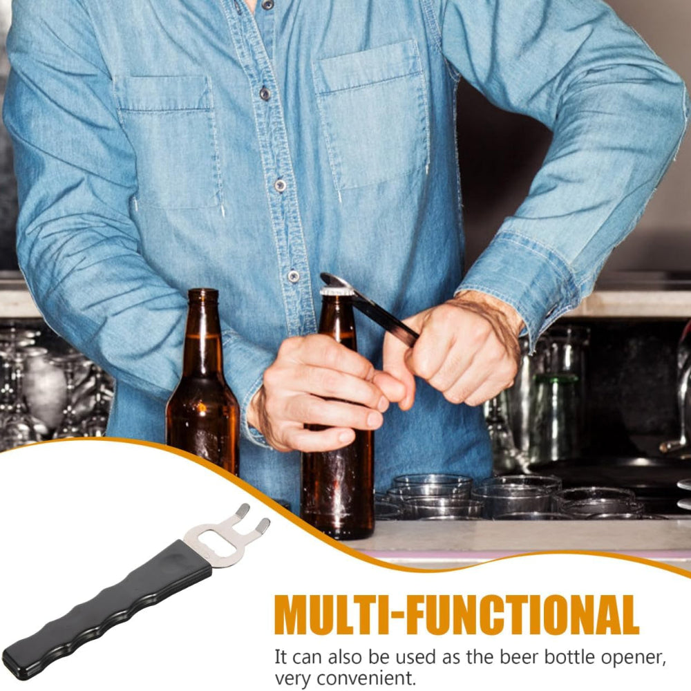 Person using a multi-functional tool to open a beer bottle in a kitchen setting.