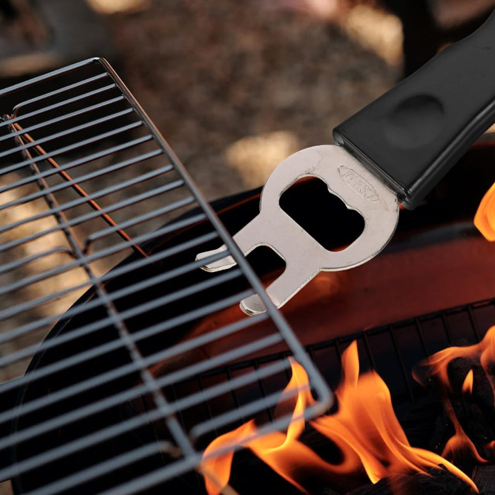 Metal bottle opener on a grill with flames in the background