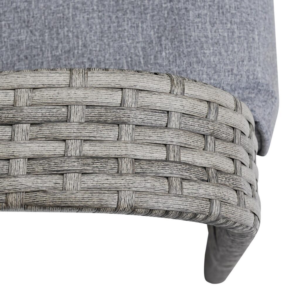 Close-up of a woven chair seat with a gray cushion on a white background