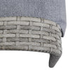 Close-up of a woven chair seat with a gray cushion on a white background