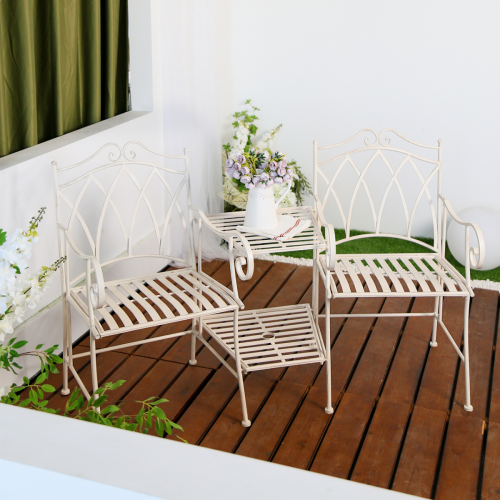 Companion 3 Piece Outdoor Setting in white colour in a patio setting with house wall and plants in the backdrop.