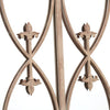 Decorative metal railing with intricate designs on a white background