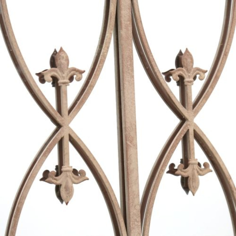 Decorative metal railing on mirror with intricate designs on a white background