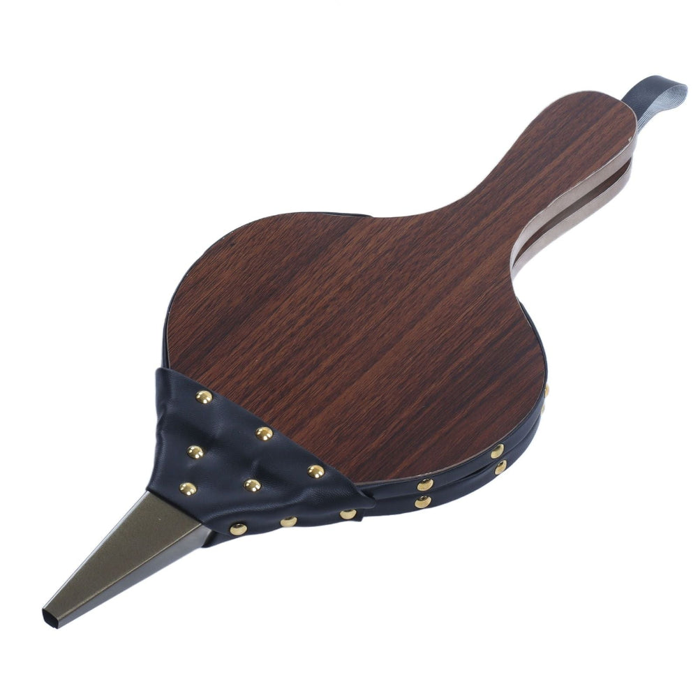 A decorative fireplace bellow with a dark brown wood-grain finish, a black leather strap with gold-tone studs, and a metal pointed tip, shown on a plain white background.