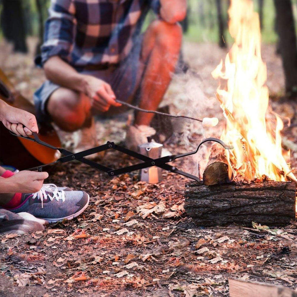 Two people roasting marshmallows over a campfire in a forest setting.