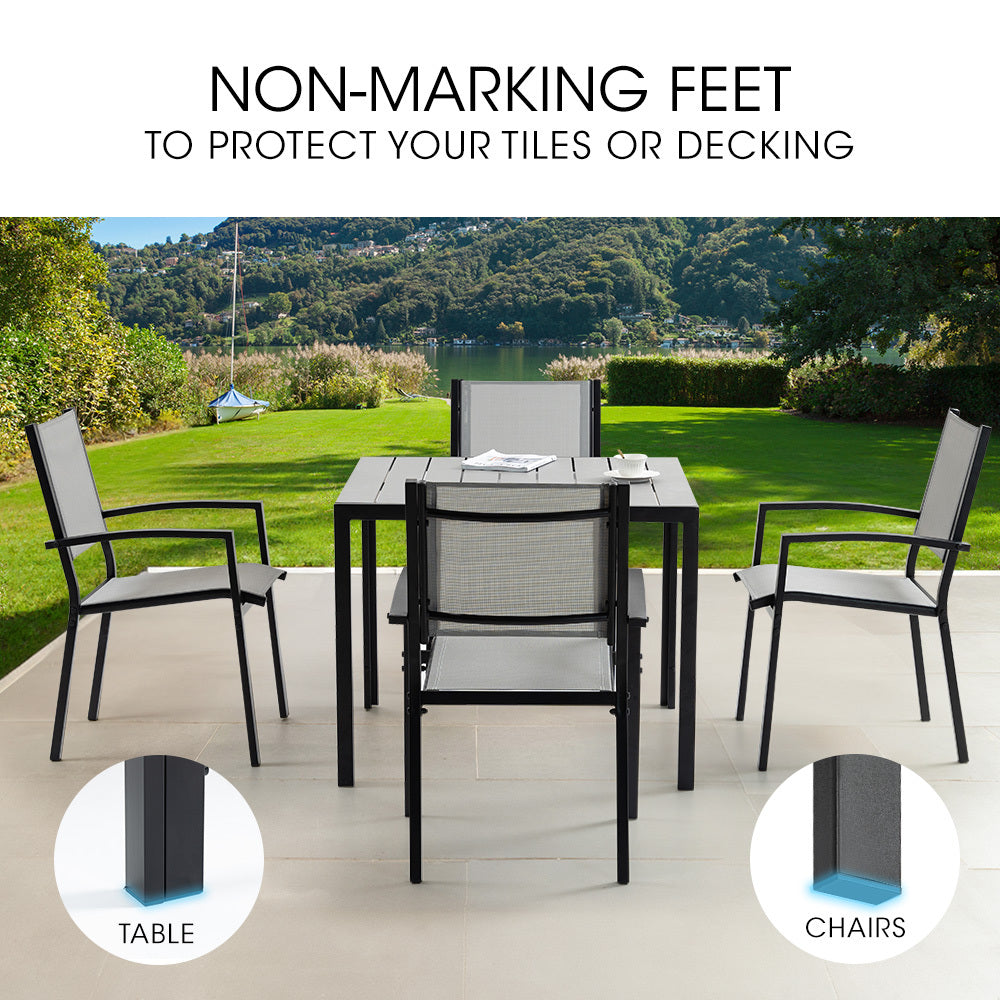 Outdoor dining set with chairs and table on a patio, featuring non-marking feet.