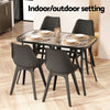 Dining table set with chairs on a wooden floor, labeled 'Indoor/outdoor setting'.