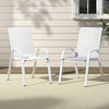Two white chairs on a patio with a neutral background