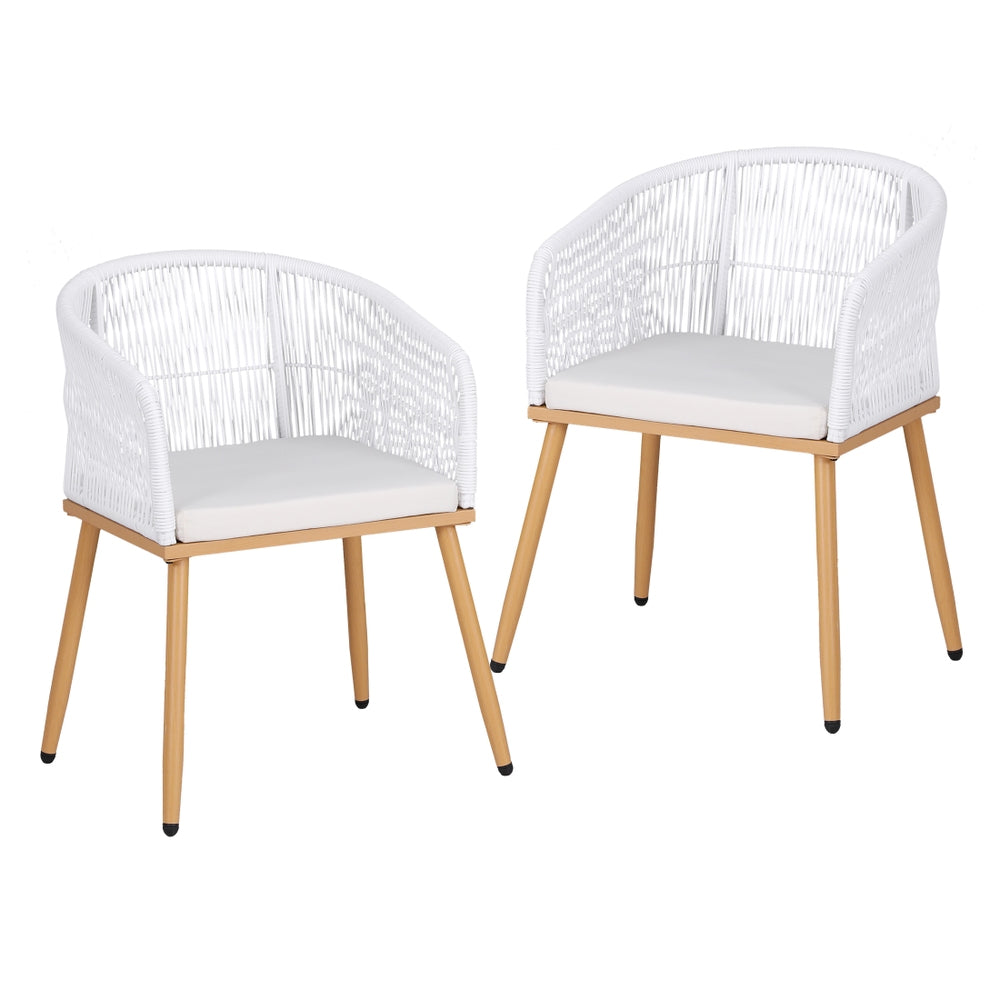 Two white wicker chairs with wooden legs on a white background