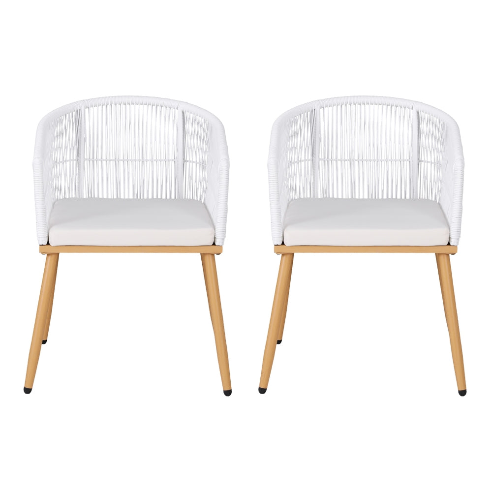 Two white cushioned chairs with wooden legs on a white background