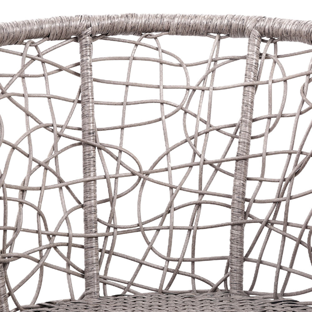 Close-up image of a grey high-backed rattan chair showing its back design and weave and set against a white background.