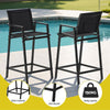 Two black outdoor bar stools with features highlighted near a pool.