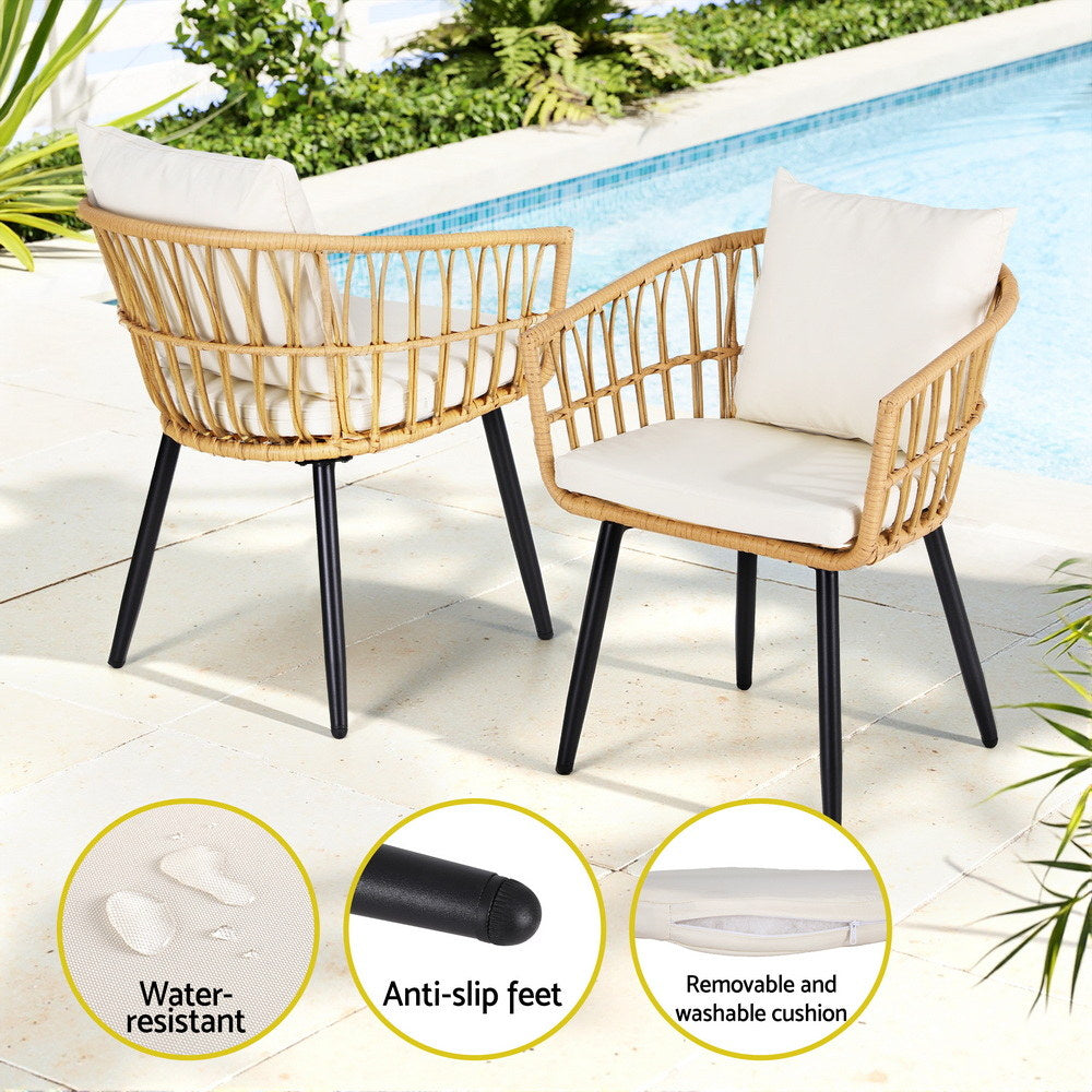 Two wicker chairs with white cushions by a pool, featuring water-resistant, anti-slip feet, and removable washable cushions.