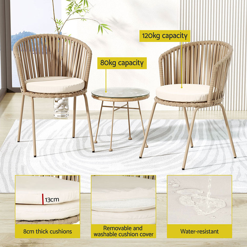 Three-piece bistro set including two beige chairs with rope weaving and a matching beige coffee table with a glass top, in a patio setting. There are 3 inset images showcasing the cushions - their thickness, removable covers and water resistant. 