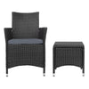 A black wicker chair with cushion and a matching black wicker side table with a glass top, on a white background.