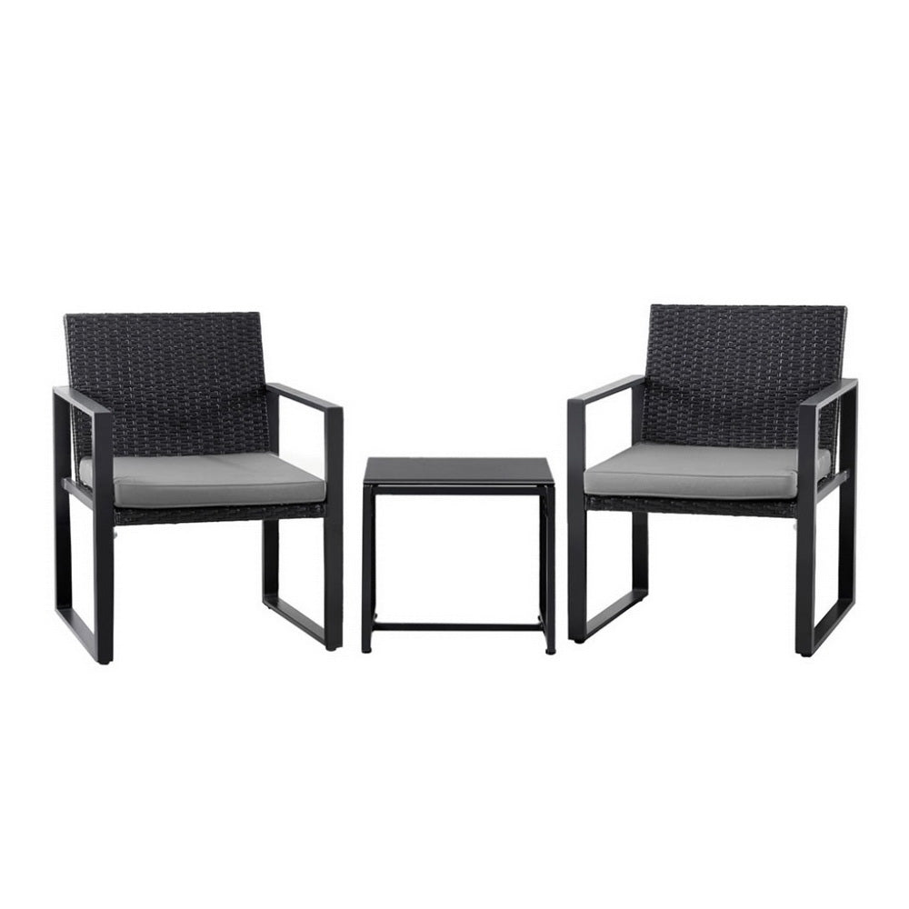 Two black chairs with gray cushions and a matching table on a white background