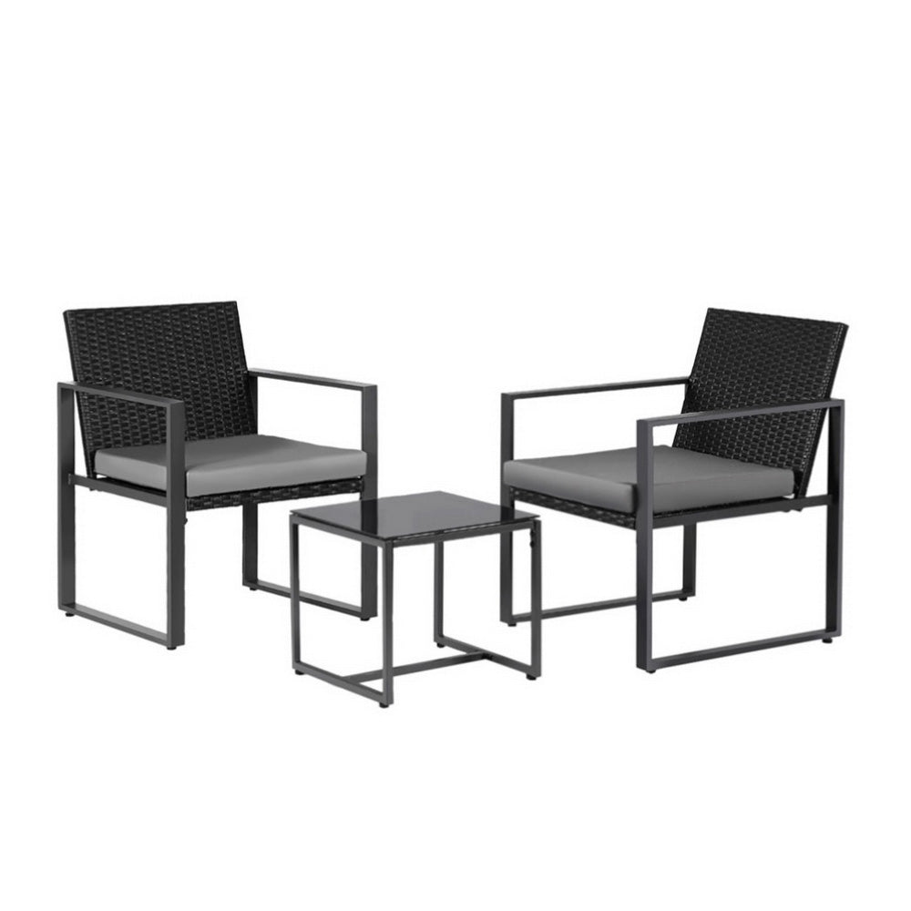 Two black chairs with gray cushions and a matching side table on a white background