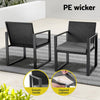 Two black wicker chairs with gray cushions on a patio, featuring smooth handle and zipped cushions.