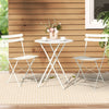 A Gardeon 3PC Outdoor Bistro Set consisting of a folding Table and Chairs in White, with 2 cups and saucers and a vase of flowers on the table, all set on a wood deck on a weaved and striped floor mat with a wooden house and garden in tthe background.