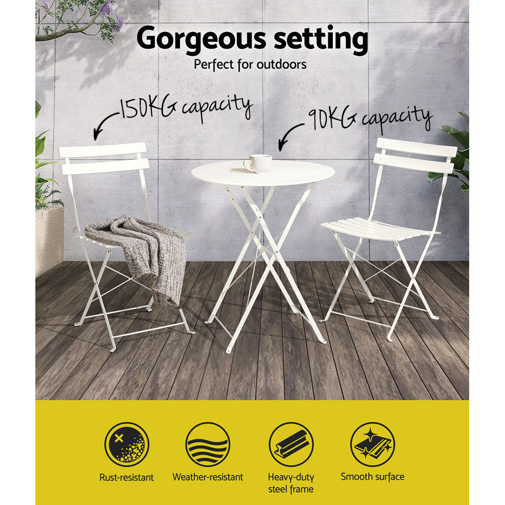 A Gardeon 3PC Outdoor Bistro Set consisting of a folding Steel Table and two folding Chairs in White, showing its weight capacities and set on a wooden floor in front of a tiled wall and some plants in the background.