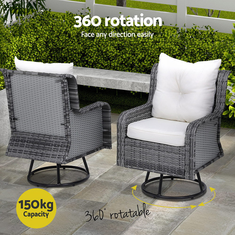 Two outdoor chairs with grey weave pattern and white cushions, one facing forward and one facing backwards, showcasing their 150kg weight capacity and 360-degree rotating seats. Set in an outdoor patio setting on a cement tiled surface in front of a cement bench with hedges behind.
