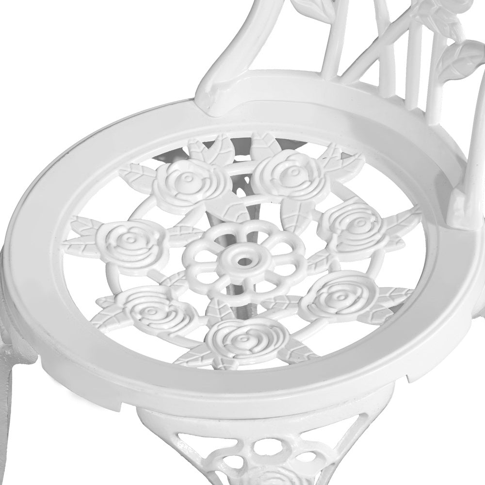 Close-up view of the top of seat of a white Gardeon chair with rose designs, set against a white background.