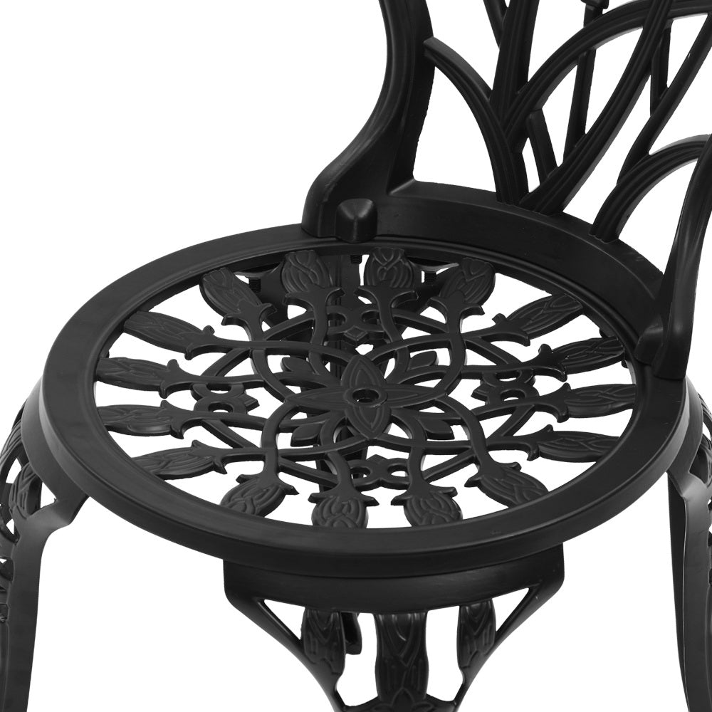 Close-up view of the black Gardeon seat part of the chair with intricate cut-out tulip flower patterns, on a white background.