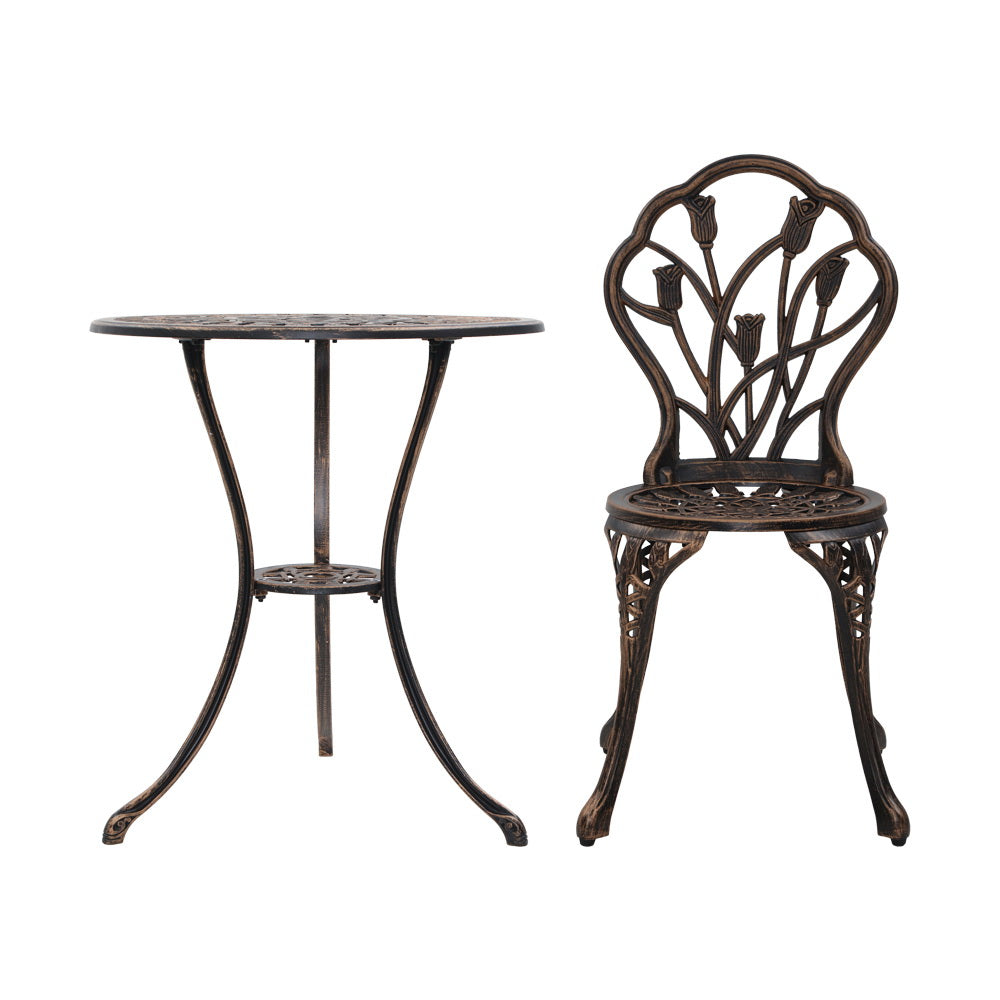 A bronze Gardeon round table and chair with intricate cut-out tulip flower patterns, on a white background setting.