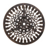 Close-up view of the bronze Gardeon round tabletop with intricate cut-out tulip flower patterns, and parasol hole in the middle on a white background setting.